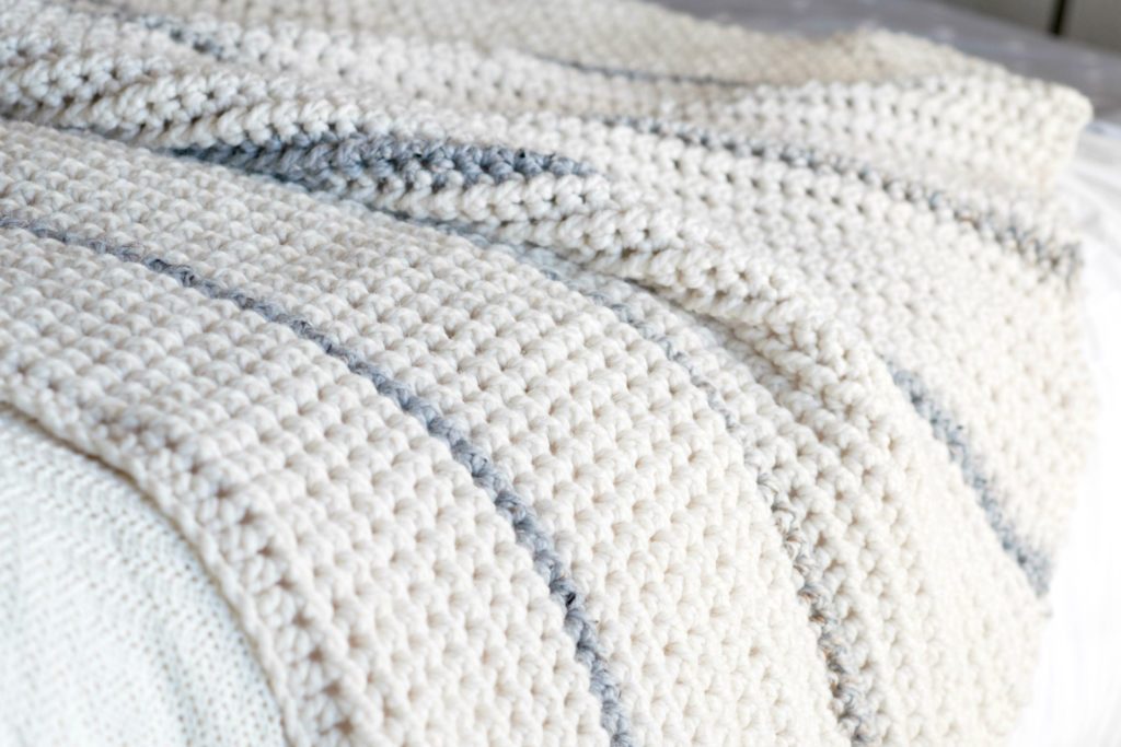 Winter Chunky Ribbed Crochet Afghan - This list has the best crochet afghan patterns out there. From chunky, thick fabrics, to delicate details, you can find whatever you’re looking for. #CrochetAfghanPatterns #CrochetPatterns #AfghanPatterns #FreeCrochetPatterns