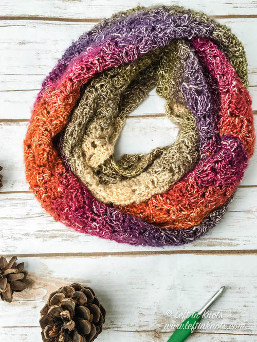 Eventide Infinity Scarf - If you’re just learning how to crochet, a crochet infinity scarf will be your best friend. Take advantage of this and make one for the people you love. #CrochetInfinityScarf #ScarfCrochetPatterns #CrochetPatterns