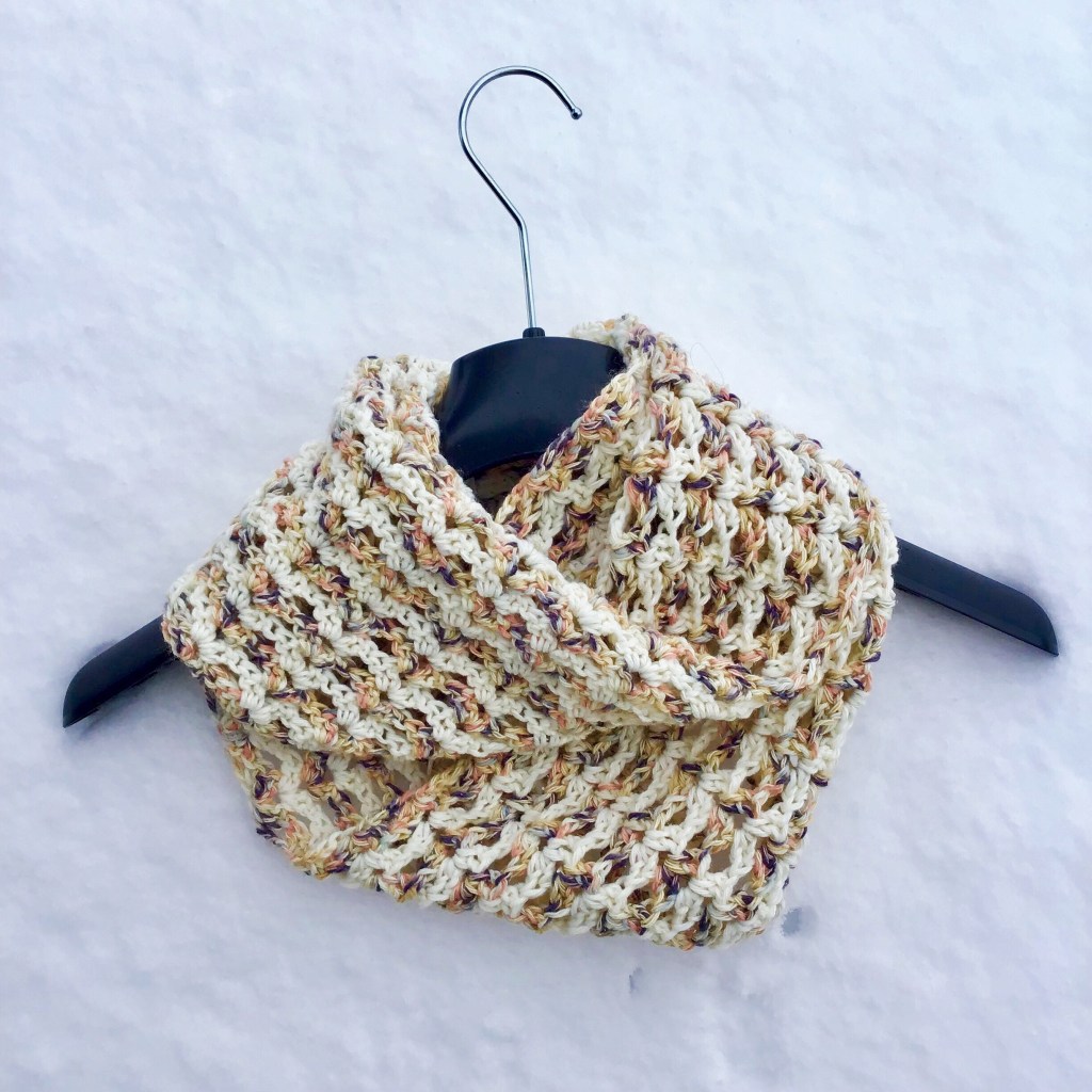Ineffable Infinity Scarf - If you’re just learning how to crochet, a crochet infinity scarf will be your best friend. Take advantage of this and make one for the people you love. #CrochetInfinityScarf #ScarfCrochetPatterns #CrochetPatterns