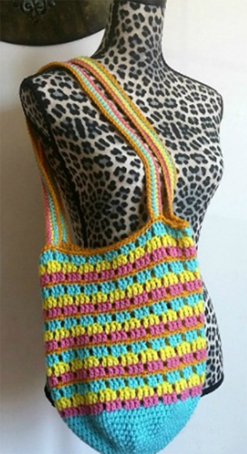 Summer Stripes Crochet Bag - Are you ready for the best crochet bag patterns out there? This list has 18 fun summer bags and they’re all free crochet patterns! #CrochetBagPatterns #EasyBagPatterns #FreeCrochetPatterns