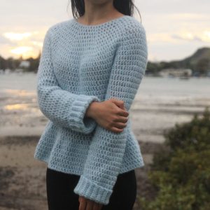 Julia Peplum Crochet Sweater - These 16 super easy crochet sweater patterns are the best we’ve found. There’s a good variety to choose from whether you like them light, cropped or with a classic look. #easycrochetsweaterpatters #easycrochetpatterns #crochetsweaters