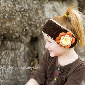 Falling Flowers Ear Warmer - Check out these cute, versatile and functional crochet ear warmer patterns and get started on your stock before the cold sets in! #crochetearwarmerpatterns #crochetearwarmers #crochetpatterns