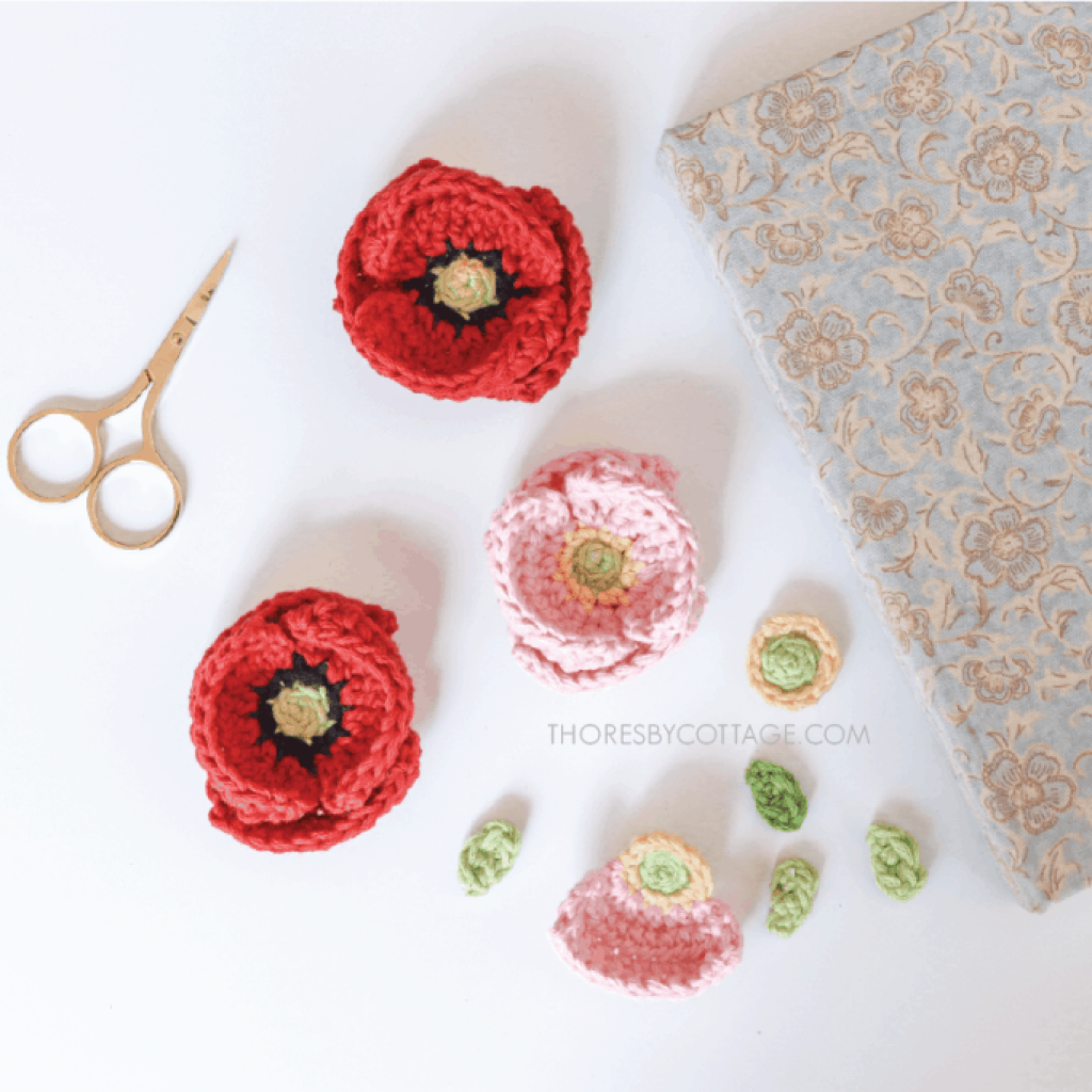 Crochet Poppy flowers with a notebook and scissors