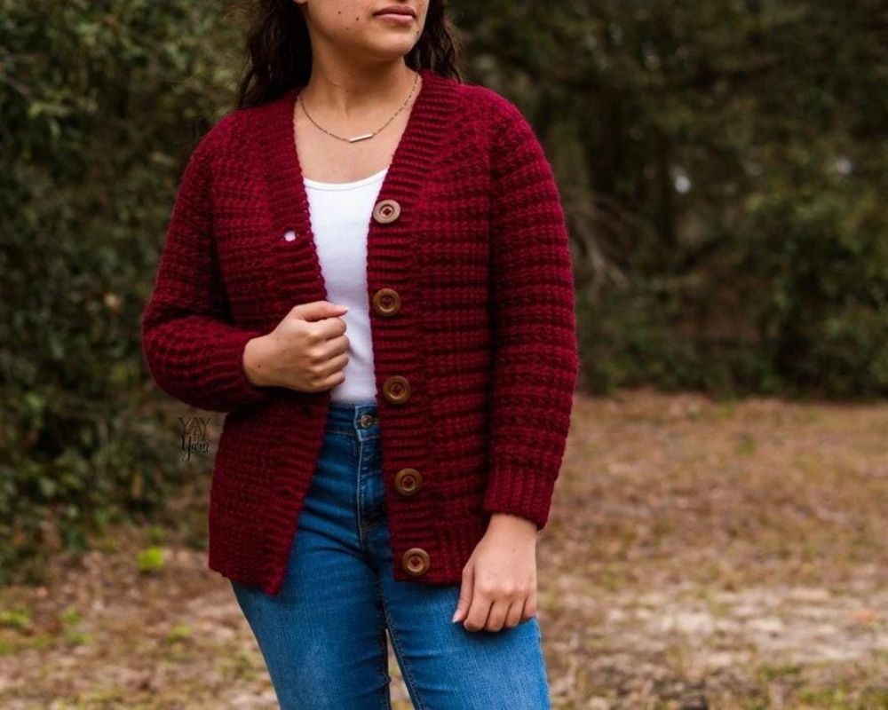 Woman wearing simple crimson cardigan crochet