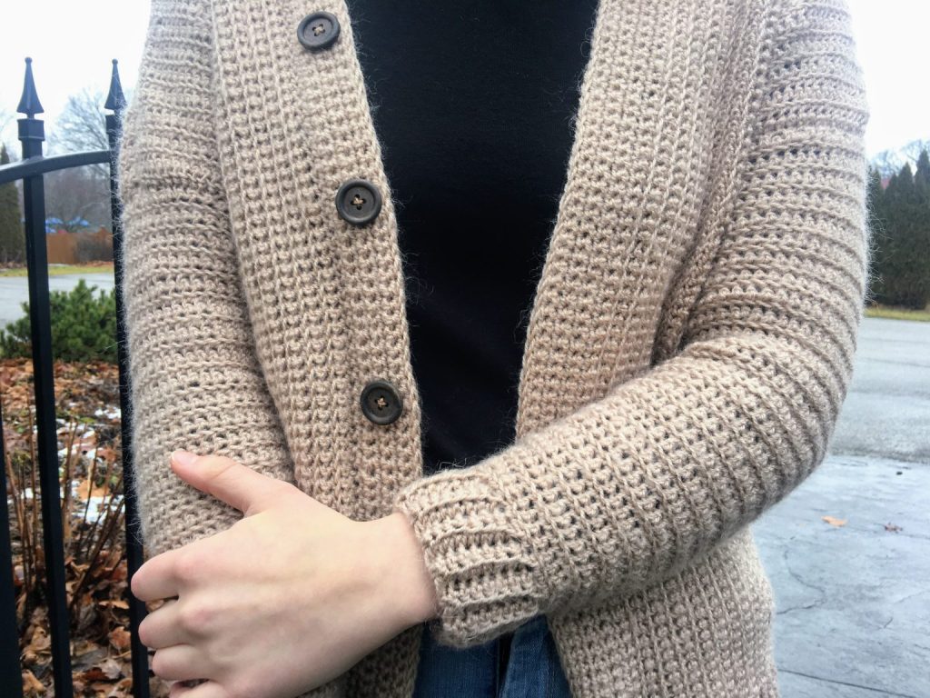 Woman wearing classic button cardigan crochet
