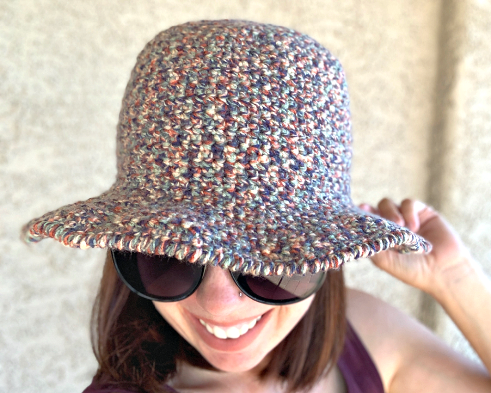 Woman wearing wide-brimmed bucket hat