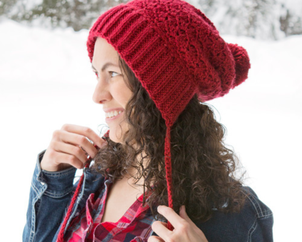 Woman wearing cranberry twist bonnet crochet