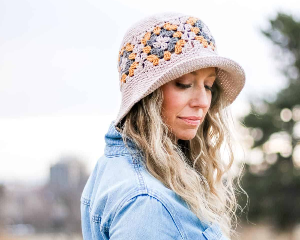Woman wearing granny square bucket hat