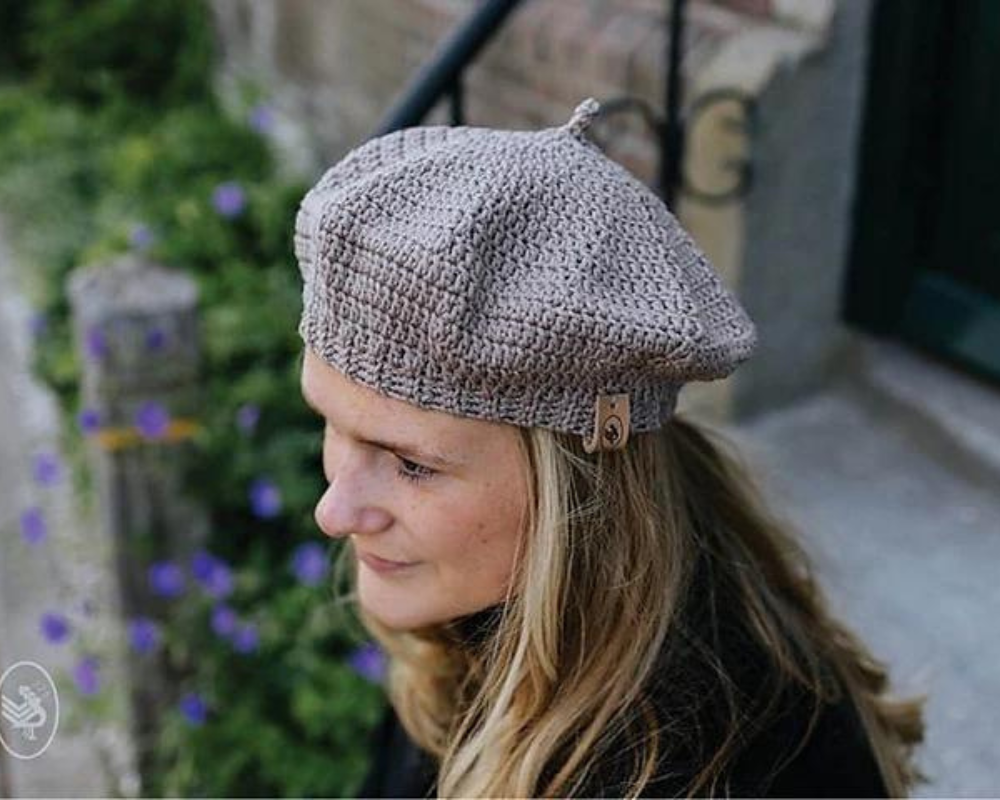 Woman wearing beret crochet hat