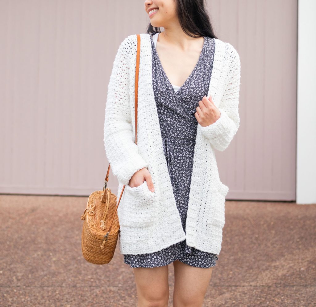 Woman wearing long textured cardigan with pockets